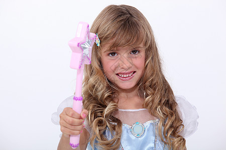 打扮成公主的小女孩魔法乐趣庆典裙子孩子粉色派对卷曲生日童年图片