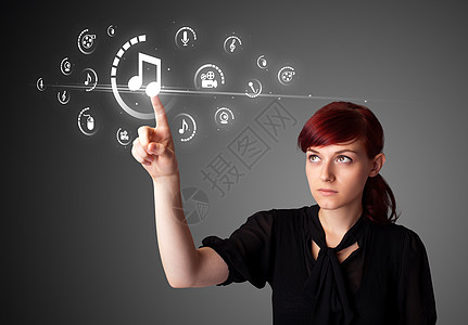 商业妇女按下虚拟媒体类型的纽扣电脑技术商务播放器信使列表乐趣互联网手指音乐图片