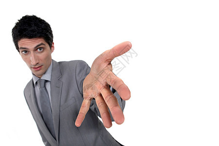 商务人士展示他的手解决方案男人身体人士手势商业套装代理人财产商务图片