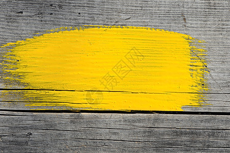 木木背景的油漆刷子黄色中风图片