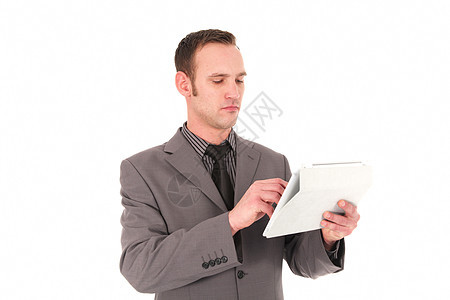 在手持平板电脑上工作的商务人士 在他的平板电脑上工作的商务人士图片