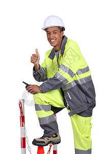 穿荧光外套和长裤的公路工人图片