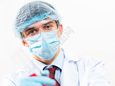 在实验室工作的科学家们医生外套男人液体实验化学家生物烧杯技术化学图片