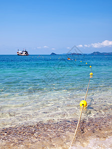 火种和游乐海景海浪海滩环境漂浮蓝色天空石头旅行巡航图片