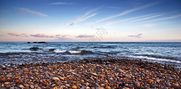 日落时布迪利格海滩英语卵石太阳海岸旅行海岸线日出侏罗纪反射海洋图片