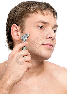 一个年轻英俊男子刮胡子的肖像卫生成功男性眼睛牙齿头发剃须力量成人时尚图片