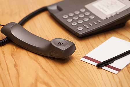 办公室电话的特写图像技术按钮桌子讲话拨号听筒管子空白键盘电子图片