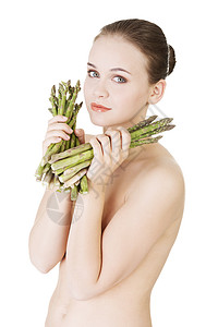 拥有健康食物的漂亮女人  香皮肤蔬菜微笑肤色女士美食饮食成人头发发型图片