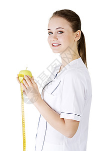 带着绿苹果和测量胶带微笑的女医生营养师女性专家药品水果磁带保健快乐医师外套图片