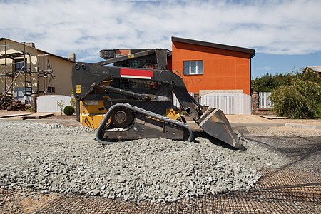 小型挖掘机工作维修地球建筑道路拖拉机修路机器推土机活动铺路图片