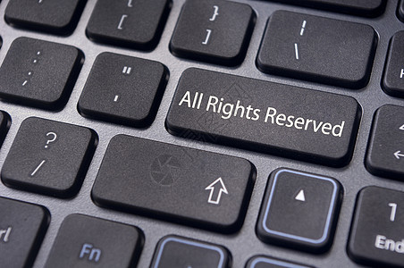 键盘上所有权利保留的信件商标商业专利事项知识分子注意法律财产互联网版权图片