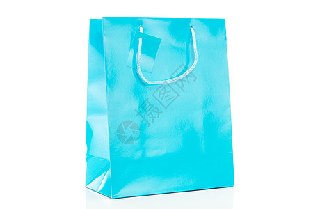 白色背景的单一蓝色购物袋图片