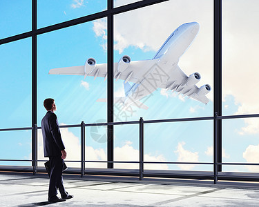 机场的商务人士喷射地平线空气窗户航空人士商务会议运输手提箱图片