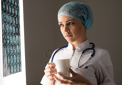 医生看X光片女士女性卫生身体儿科疾病考试成人蓝色医院图片