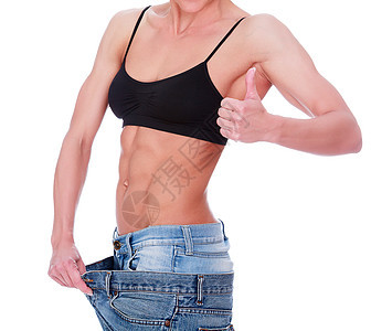 妇女穿着旧牛仔裤 显示体重下降腰部保健成人腹部饮食女性数字女士身体营养图片