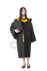 美丽的微笑的年轻毕业女女士站立图片