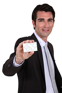 持有空白名片的男子白色套装访问合作领带人士工作卡片矩形男人图片