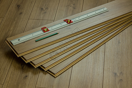 使用铅笔和仪表的橡木层地板工作木材风格建造橡木装饰压板材料木工木头改造图片