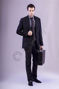 灰色青年商务人士套装领带商业公文包身体黑色男人姿势男性公司图片