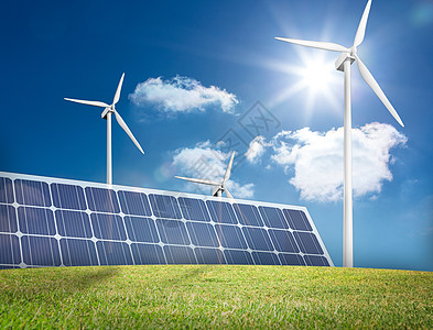 太阳能风能大型太阳能电池板和三个风力涡轮机背景