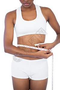 测量腰部的年轻女子女性腰围卷尺文胸周长躯干健康饮食身体重量图片