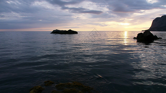 日落戏剧性海洋支撑海浪海岸线地平线天空天气石头海岸图片