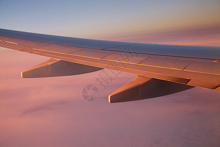 飞行飞机阳光运输远景客机空气窗户戏剧性太阳日出图片