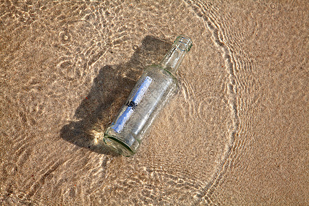 瓶中的信件笔记天空晴天阳光抛弃海岸线支撑贝壳瓶子沙丘图片