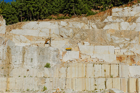 塔索斯白大理石采石场挖掘机推土机岩石爬坡地球活动工作搬运工纪念碑车辆图片