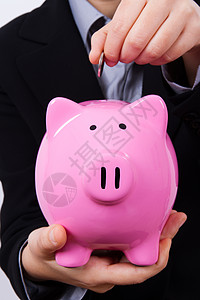 商业女商务人士和小猪银行钱包投资经理货币硬币动物工人钱盒老板小猪图片