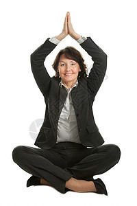 坐在莲花位上的女商务人士控制沉思孤独女孩套装女性平衡工作瑜伽办公室图片