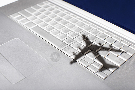 苹果微软键盘上的 Jumbo喷气机的阴影笔记本生长白色喷气速度想像力服务客机电脑进步图片