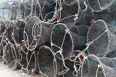 捕捞渔业和海产食品的陷阱工具螃蟹龙虾钓鱼绳索海鲜码头海洋港口绿色图片