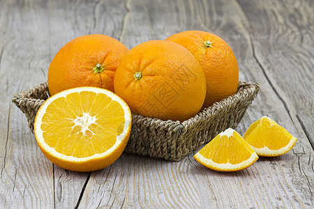 篮子里的新鲜橙子宏观热带食物水平季节水果桌子饮食花园果汁图片