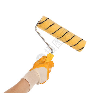 手与油漆笔滚筒房间条纹工人橡皮黄色乐器手腕白色维修工具图片