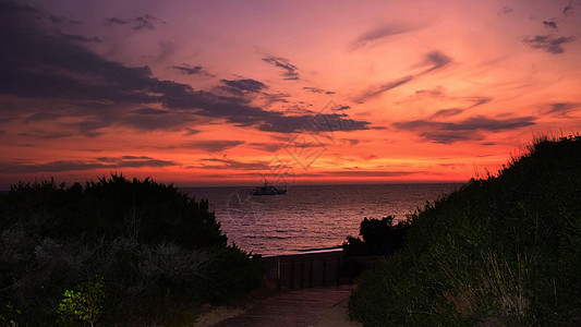 海滩的日落天空海岸血管太阳墙纸壁纸橙子天空旅行海景盐水图片