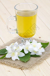 茉菊茶和茉莉花植物餐具叶子饮料早餐草本植物药品杯子玻璃花瓣图片