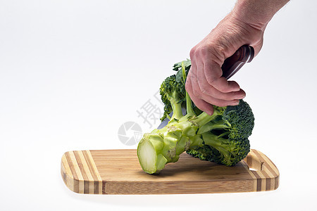 手握刀子的蔬菜花椰菜花椰菜图片