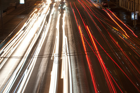 夜间路驾驶车辆大灯土地灯光红色街道运输速度尾巴图片