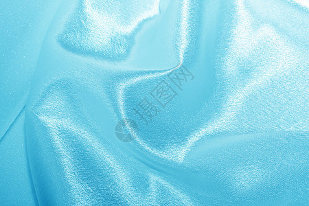 蓝丝帆布纺织品海浪织物布料曲线材料窗帘奢华蓝色背景图片