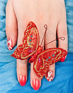 红指甲保养美甲纺织品蝴蝶织物红色棉布温泉手指图片