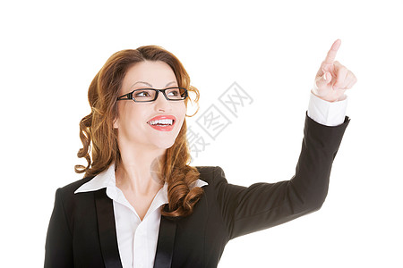 迷人的笑着微笑的女商务人士做出选择愿望职业手指成就人士推介会工作室商业屏幕女性图片