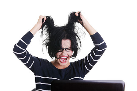 在笔记本电脑上工作的受挫妇女挫折商务压力人士黑发尖叫青少年碰撞女性学生图片