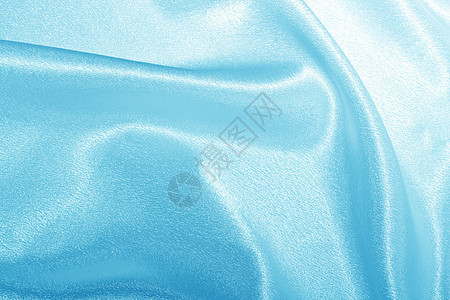 蓝丝材料织物窗帘奢华纺织品帆布曲线蓝色海浪布料背景图片