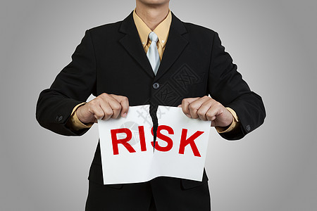 风险 一字写着风险的商务人士眼泪纸手指人士红色男人展示危险领带安全破坏灰色图片