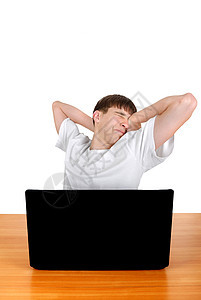 膝上型电脑后疲劳的青少年图片