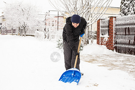 除雪季节天气工作男人男性街道人行道劳动花园风暴图片