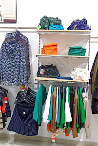 妇女服装店纺织品店铺购物商品架子精品收藏服装女士零售图片