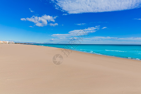 萨贡托海滩在巴伦西亚 在西班牙阳光明媚的日子波浪旅行旅游海洋晴天蓝色村庄海岸社区泡沫图片