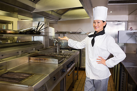 厨房有自信的女厨师女士白人工作职业帽子餐厅女性手势制服图片
